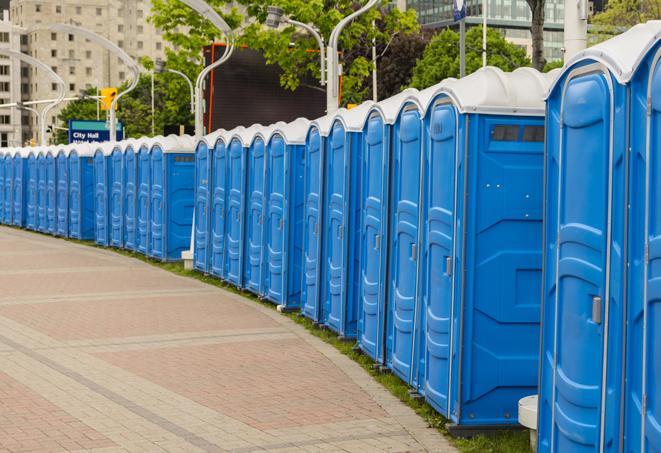 a row of portable restrooms at a fairground, offering visitors a clean and hassle-free experience in lyons